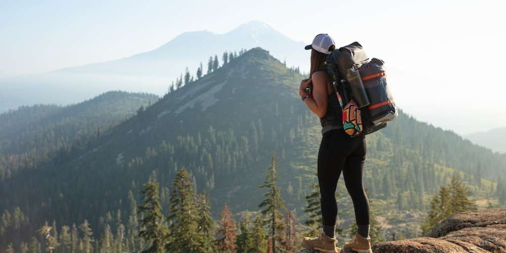Top Hiking Destinations: A person hiking amidst breathtaking natural landscapes.