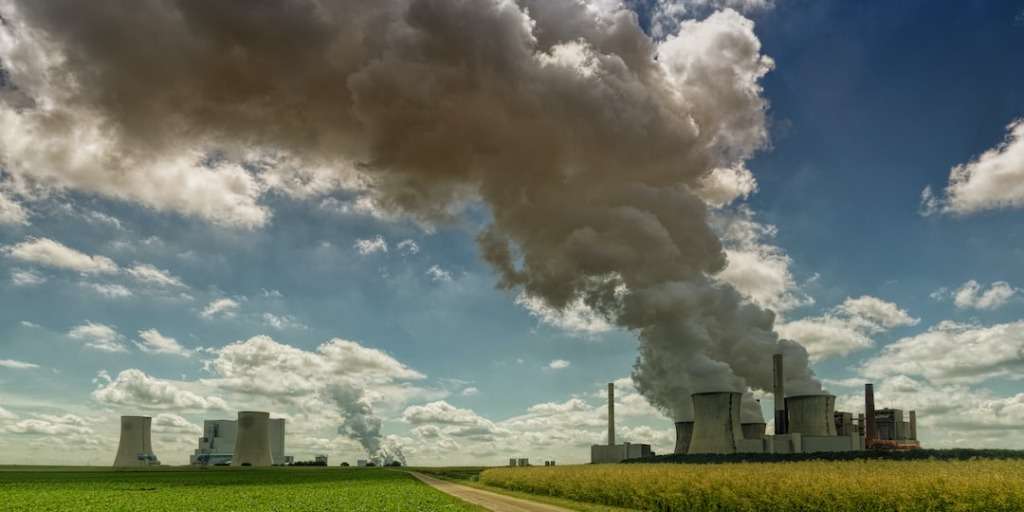 Industrial Factories Emitting Smoke and Spreading Air Pollution - Climate Change Shock: The Report's Impact.