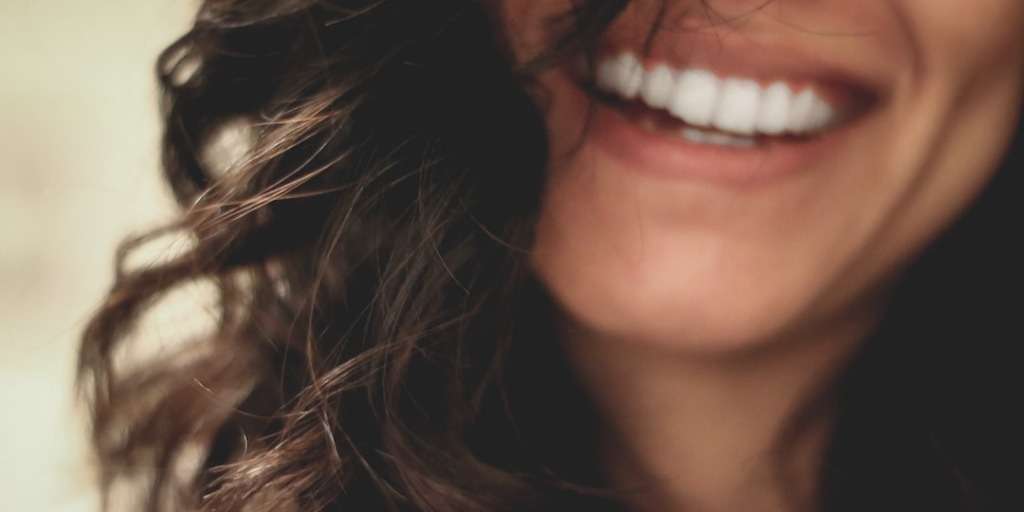 Radiant smile reflecting the bliss of engaging in your favorite hobby and happiness connection.