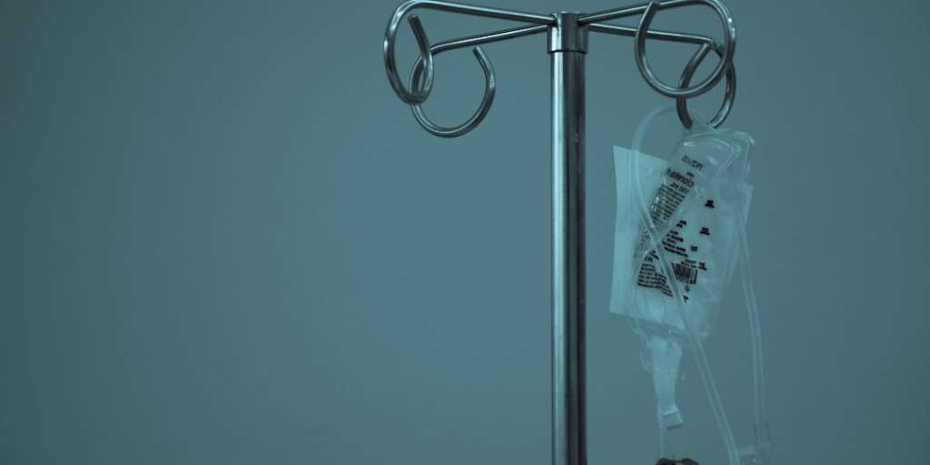 Budget Trick for Ultimate Health: An IV drip bag hanging on a stand.