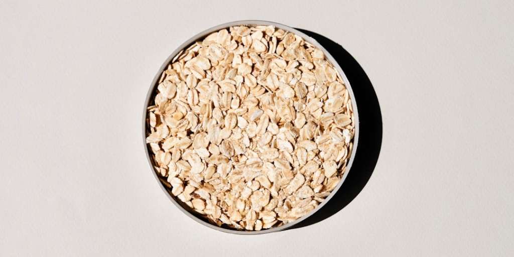 A bowl of raw oats viewed from above. Science Says Oats Can Boost Your IQ.