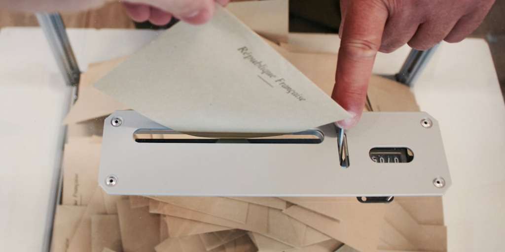 Person inserting a paper labeled 'Government Conspiracy Theories' into a secure paper shredder.